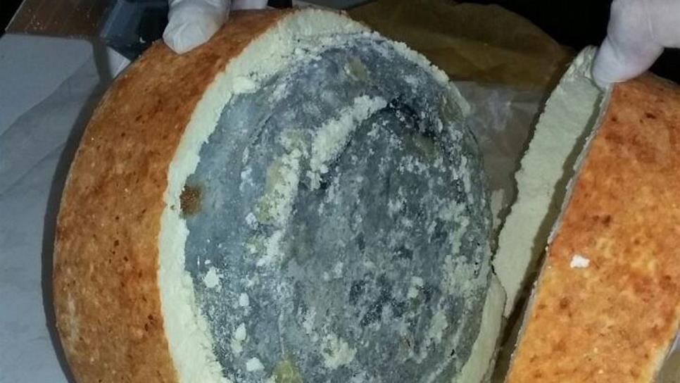 Policía federal localiza droga sintética entre piezas de queso