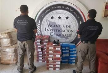 Aseguran tenis piratas en empresa de paquetería