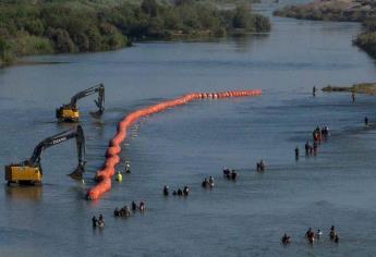 Hallan 2 cuerpos atorados en cerco de boyas con púas en Río Bravo