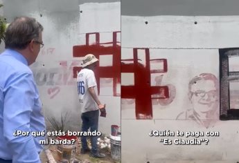 Marcelo Ebrard encuentra a pintor borrando barda con su imagen