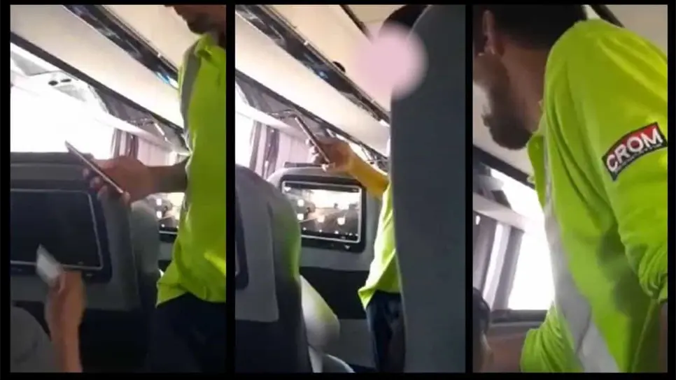 El civil sospechoso revisando los documentos de los pasajeros y tomándoles fotos.