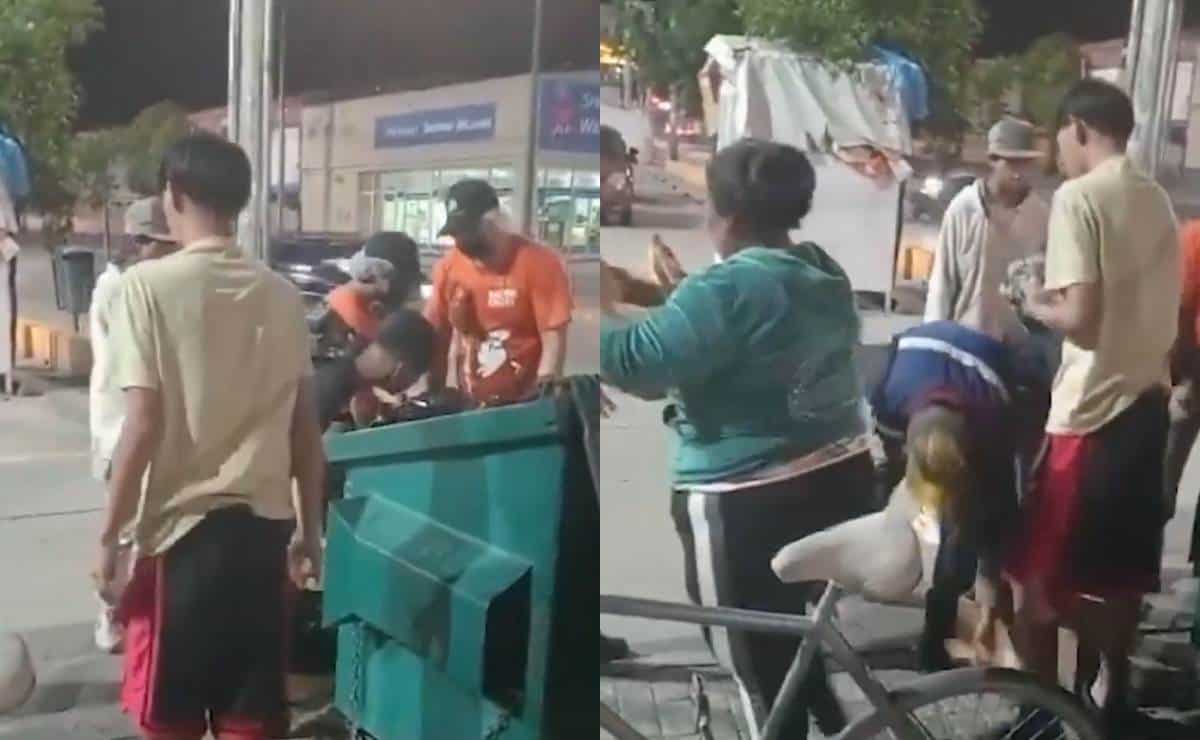 Decenas esperan que pizzería de Little Caesars cierre para ir a recoger los restos que tiran a la basura