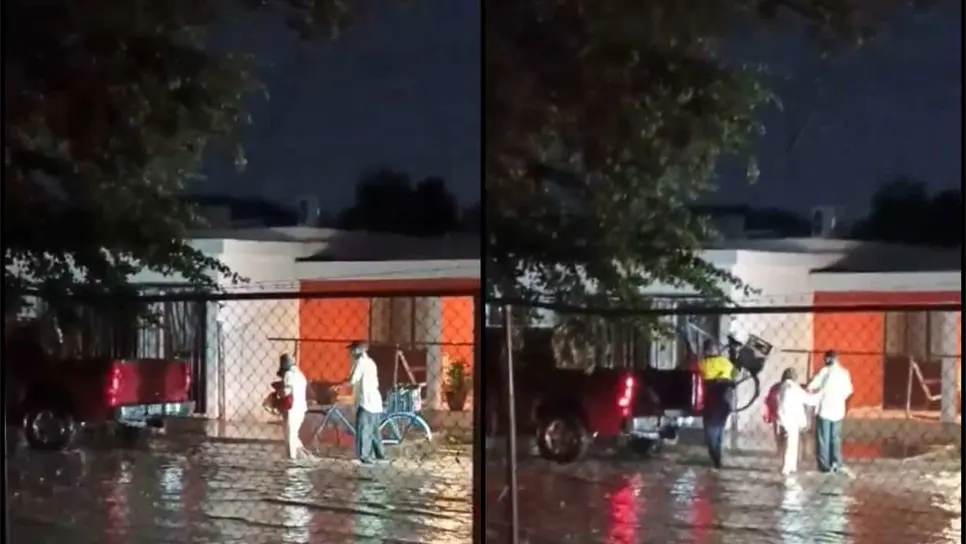 Auxilian a pareja de adultos mayores que caminaba bajo la lluvia durante tormenta en Navojoa | VIDEO