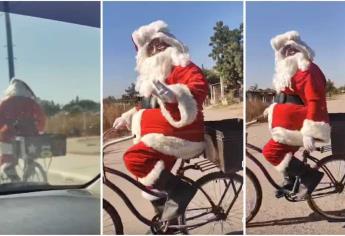 ¡Santa Claus en bicicleta por las calles de Navolato! Se dirigía a un Kinder para llevar juguetes | VIDEO