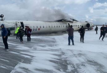 Avión de Delta Airlines se estrella al aterrizar y queda volcado | FOTOS