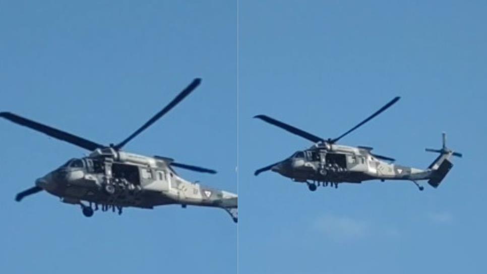 Dos helicópteros Black Hawk sobrevuelan a baja altura tras atentados a balazos en distintos sectores de Culiacán Dos helicópteros Black Hawk sobrevuelan a baja altura tras atentados a balazos en distintos sectores de Culiacán