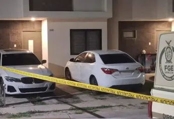Catean un domicilio en Culiacán y aseguran vehículos y un arma de fuego