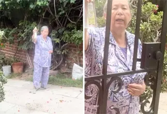Mujer acusa a joven de estar poseída por tener tatuajes y la rocía con agua bendita | VIDEO